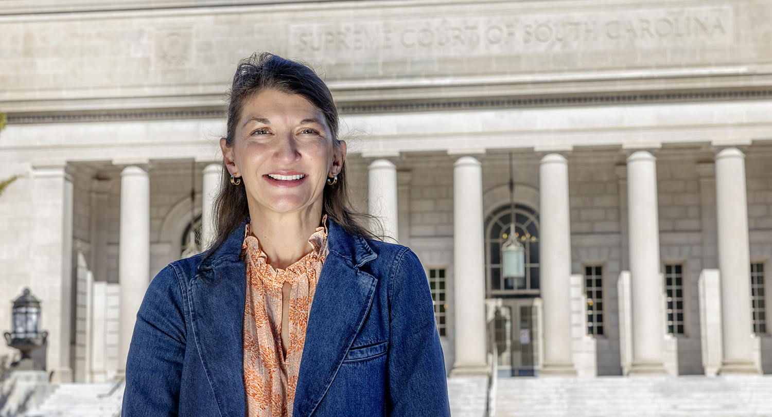 College of Social Work professor Stephanie Hunter stands across from the South Carolina Supreme Court building.