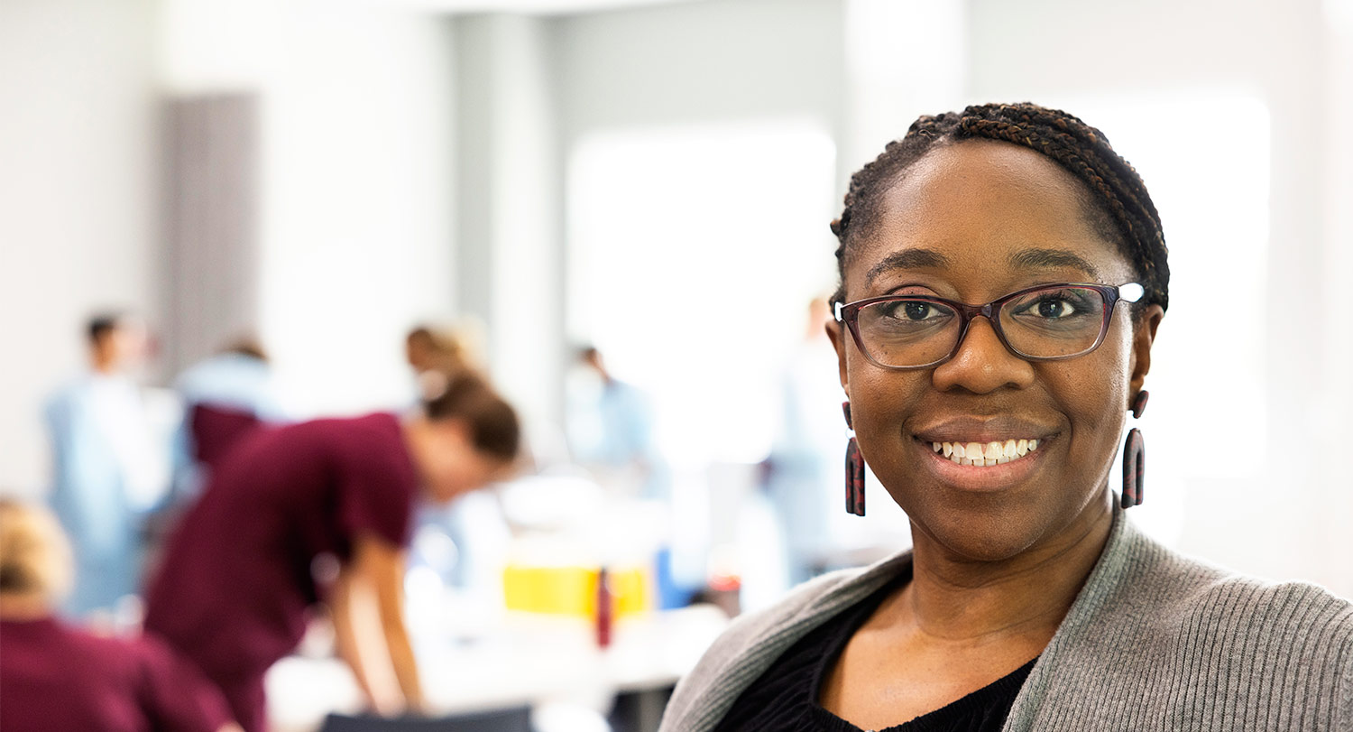 Nursing professor Joy Jackson stands in front of classroom