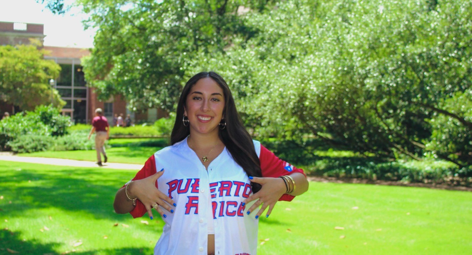 Raquel Negrón wearing a Puerto Rico baseball jersey.