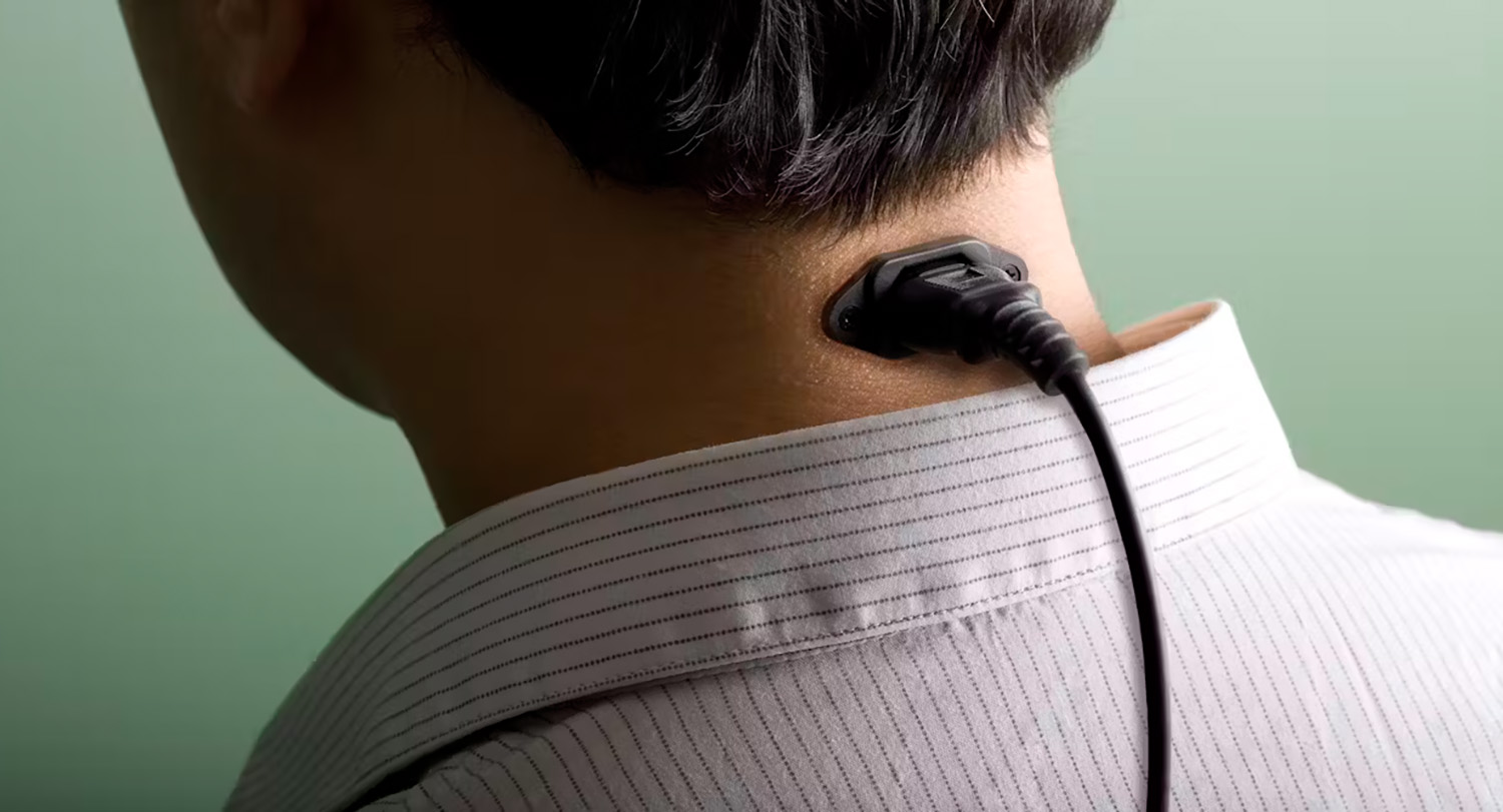 Photo illustration of man with plug in his neck.