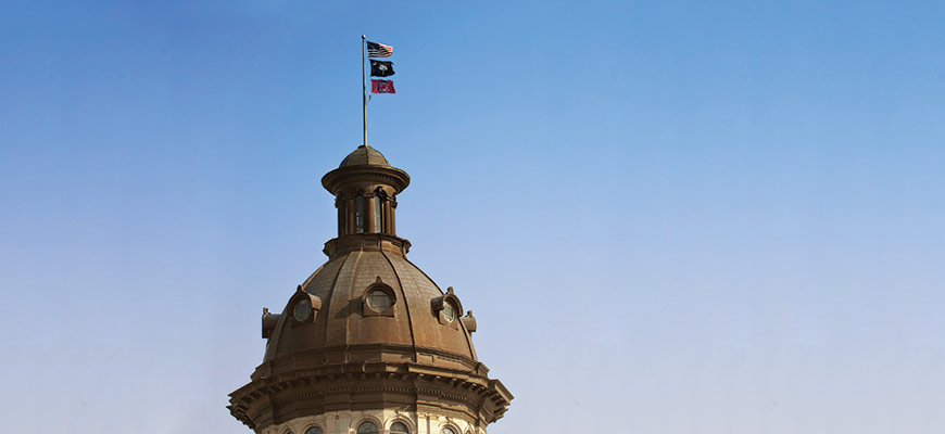Flags on the dome of the Statehouse