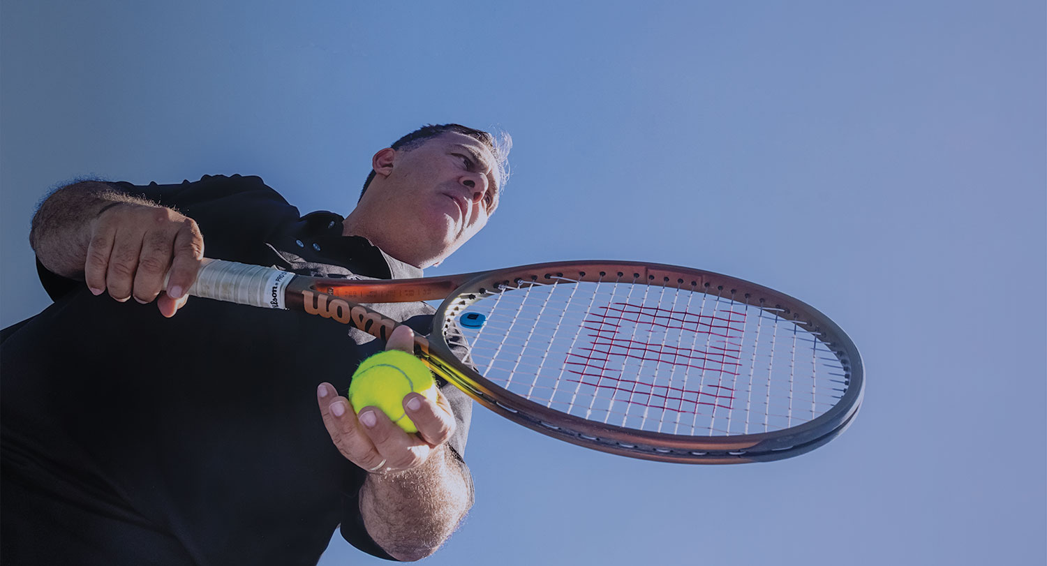 Gamecock tennis star Ricardo Acioly ready to serve the ball.