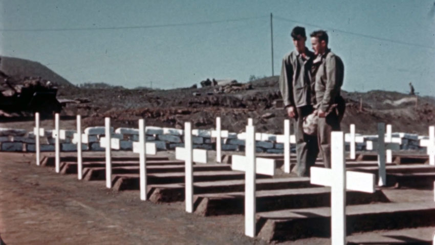Two marines standing at the Iwo Jima cemetery.