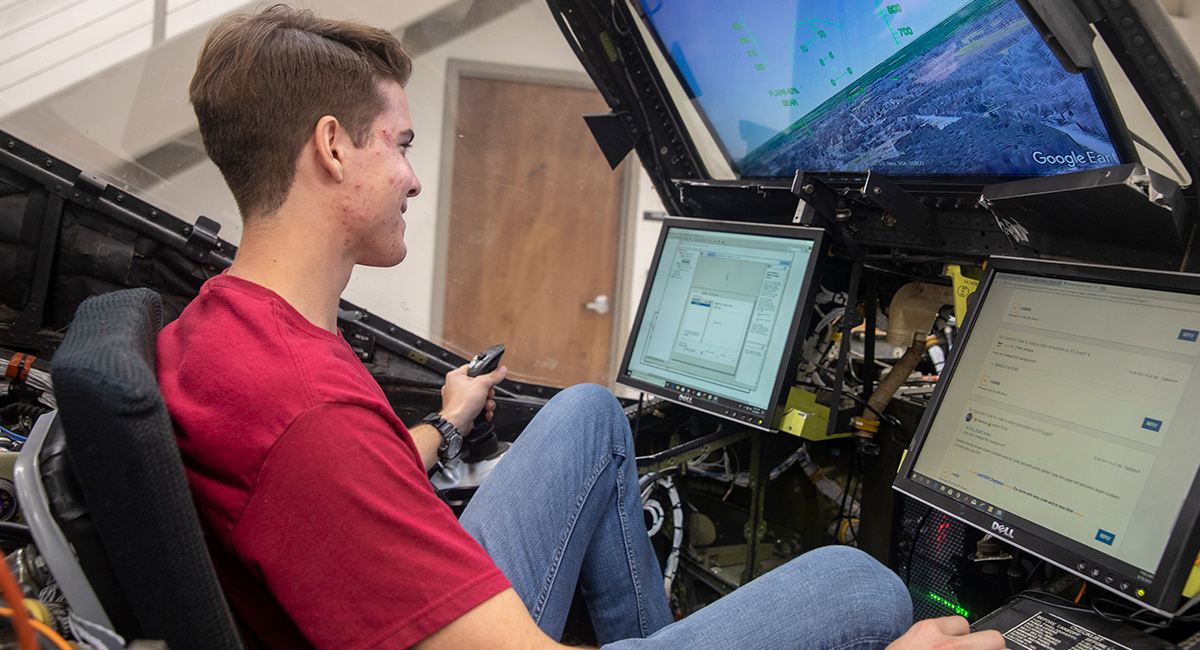 student in flight simulator