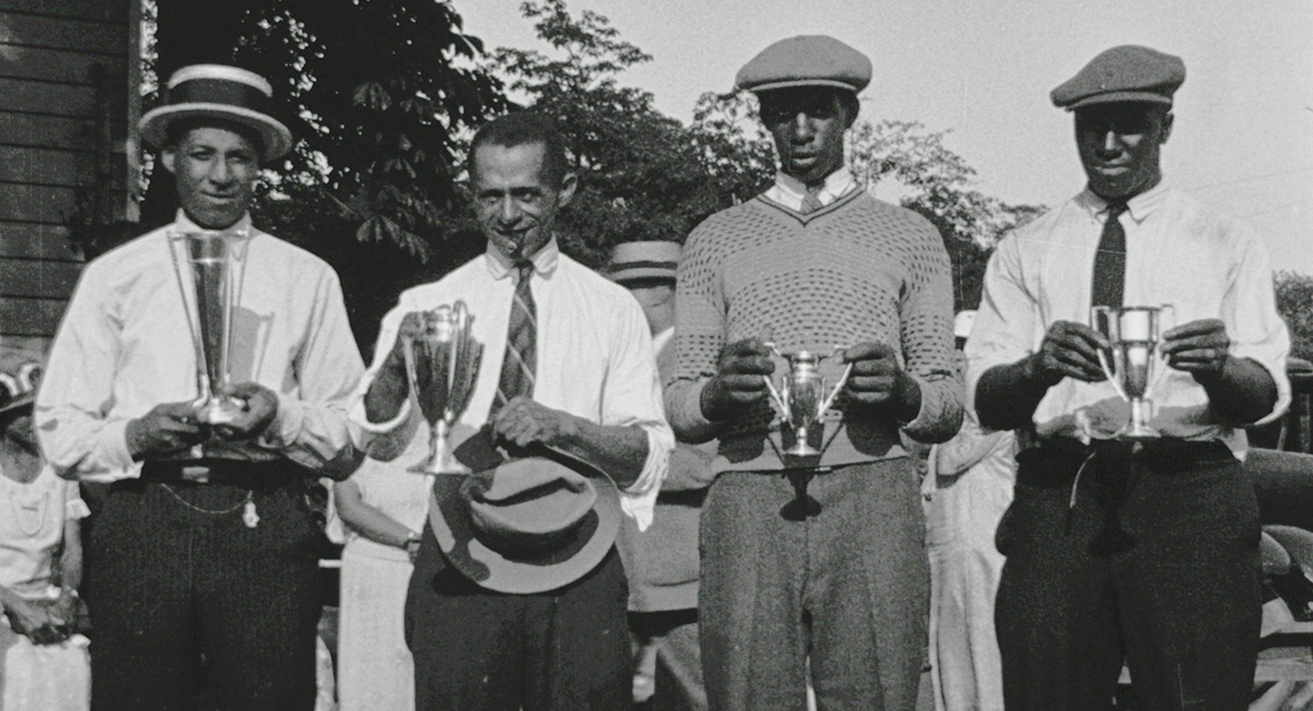 Shippen and fellow golfers with trophies