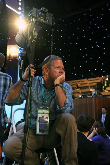 Win McNamee takes a break from photographing a political convention