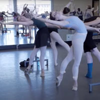 Students practice ballet in studio.