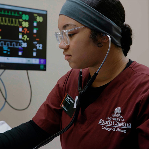 Nursing student with stethoscope.