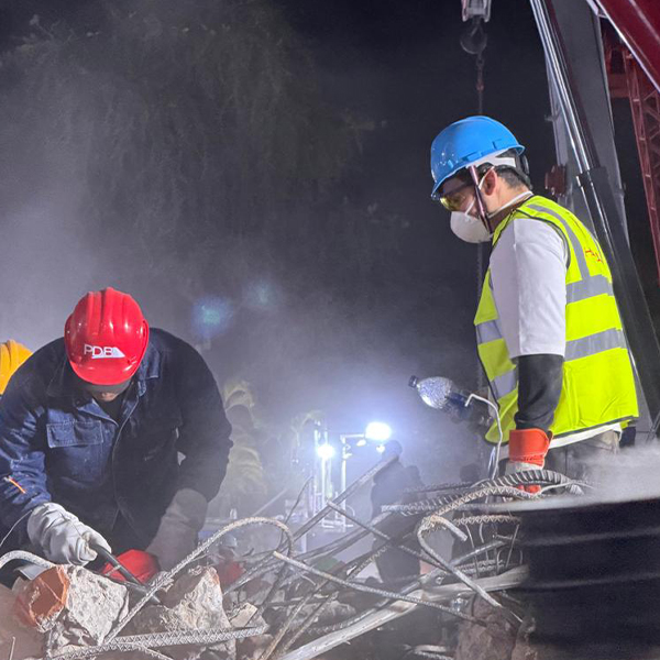 USC student Aquiles Agreda helps clean up rubble at night after two massive earthquakes struck Venezuela.