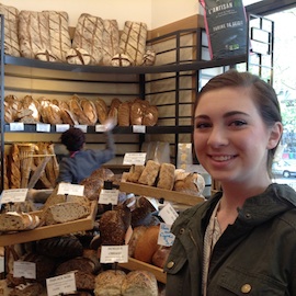 student in a french bakery