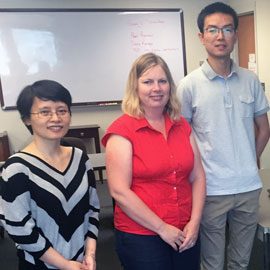 Jun Zhou, Karen Smith and Yuhang Lu work with 3D scanner 