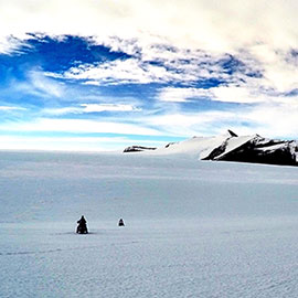 Researcher Riding Ski-Doos in Antarctica 