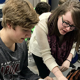 New teacher works with students
