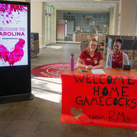 students at a welcome table