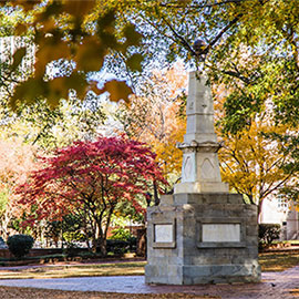 maxcy monument surrounded by fall foliage