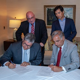 President Pastides, Dean Haemoon Oh, and Aruba officials signing the renewal