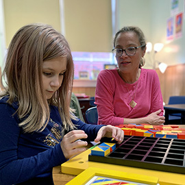 School counselor works with child using play therapy