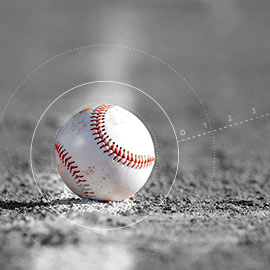 baseball sitting in the dirt