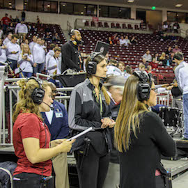 Students working at Colonial Life Arena during a South Carolina basketball game