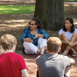 Poet Nikky Finney talks with students on the University of South Carolina Horseshoe