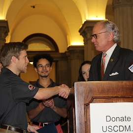 Gov. McMaster shakes hands with USCDM Pres. Justin Gill