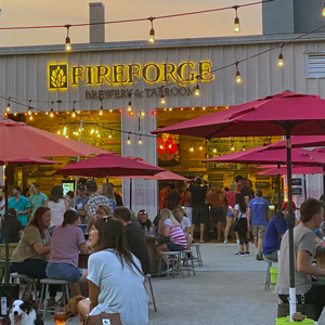 Patrons at Fireforge taproom enjoy outdoor seating.