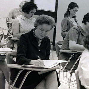 archival image of marjorie weber sitting at a desk in education classroom circa 1969