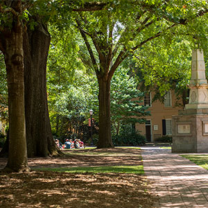 Looking across a Horseshoe sidewalk with the Maxcy Monument on the right
