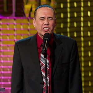 Gilbert Gottfried speaking into a microphone
