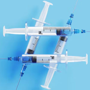 Syringes forming a hashtag symbol on a blue background