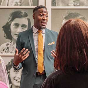 Doctoral candidate Devin Randolph gives tour of Anne Frank Center