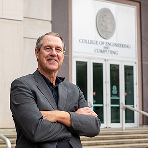 Michael Sutton stands in front of the UofSC College of Engineering and Computing.