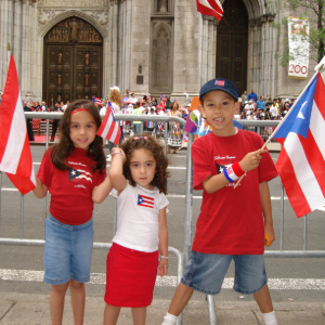 Young Negrón with family at parade in New York.