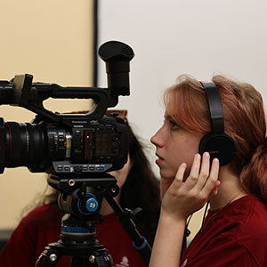 Female student using a camera