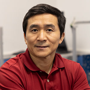 Head shot of Guoan Wang in his engineering lab