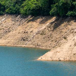 Blue water near an earthen dam