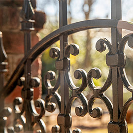 A close up image of a wrought iron gate near the Horseshoe