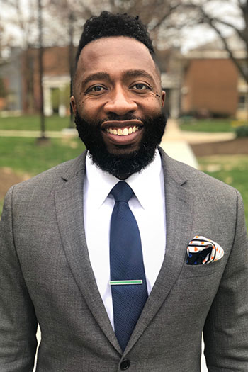 Julian Williams, the new VP of Diversity, Equity and Inclusion, smiles for a headshot.