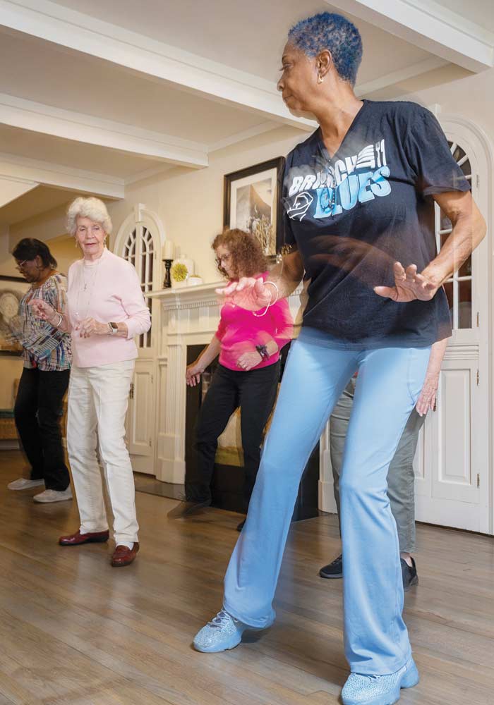 Line dancing instructor Delia Hughes brightens the afternoon at Leeza’s Care Connection