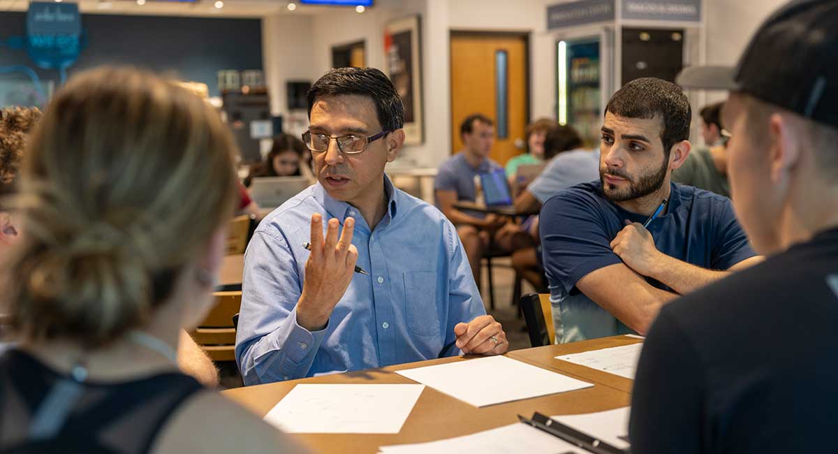 USC Molinaroli College of Engineering and Computing faculty member Juan Caicedo talks with students in Columbia.