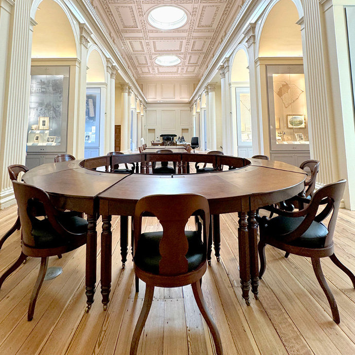A circle of historic desks in the South Caroliniana Library