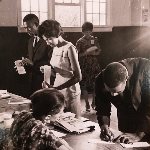 three students register for classes