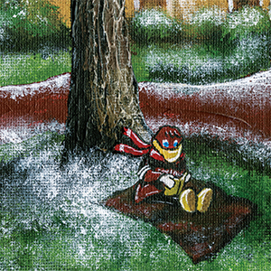 Cocky reads on a blanket under a tree with snow on the ground nearby.