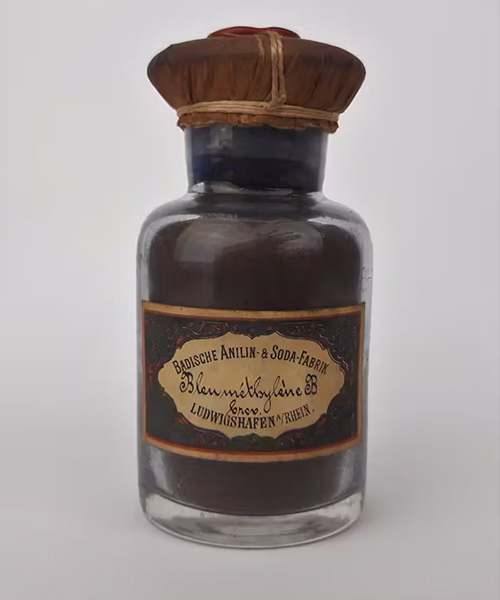 A vintage brown pharmacy bottle of methylene blue.