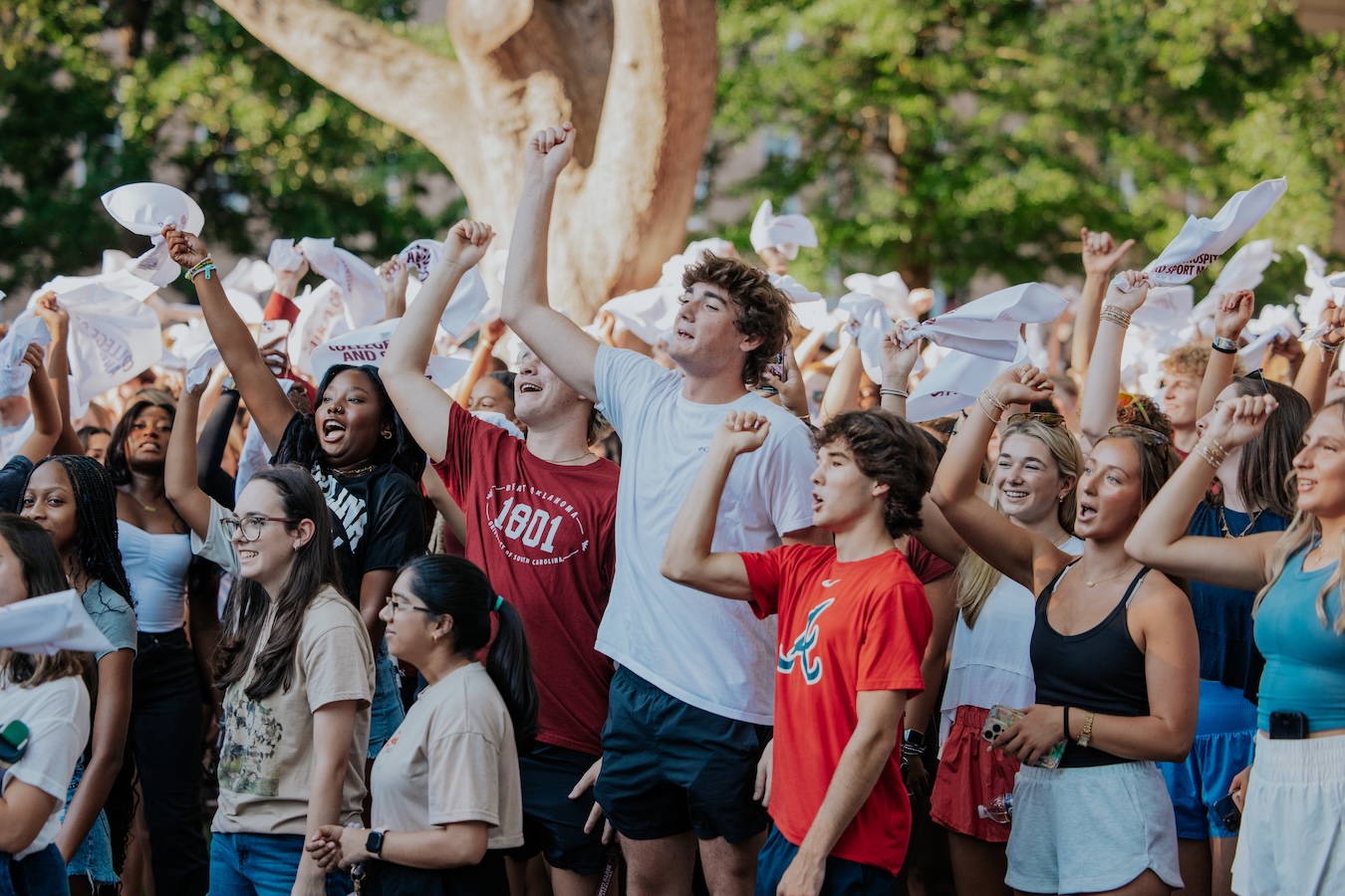 Two girls holding "Welcome Home Gamecocks" sign