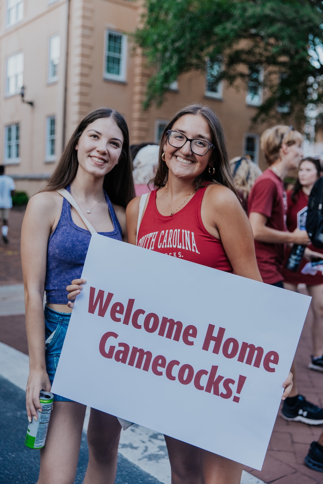 Group of students swing towels around and participating in sandstorm