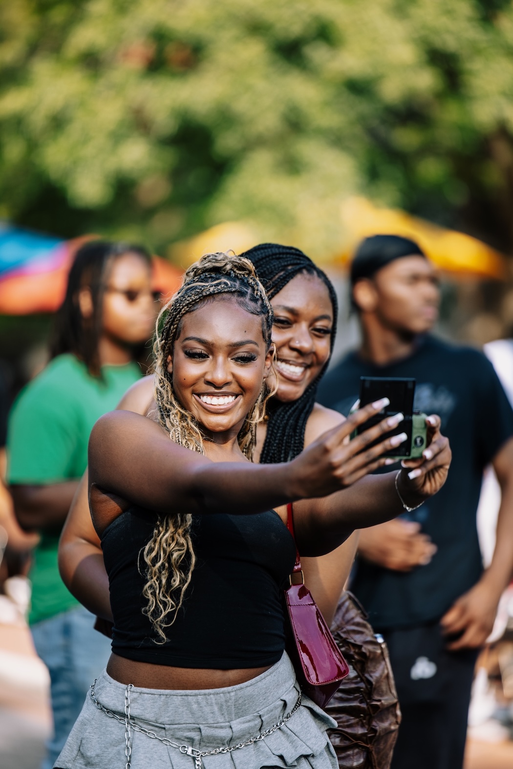 Two ladies take taking a selfie