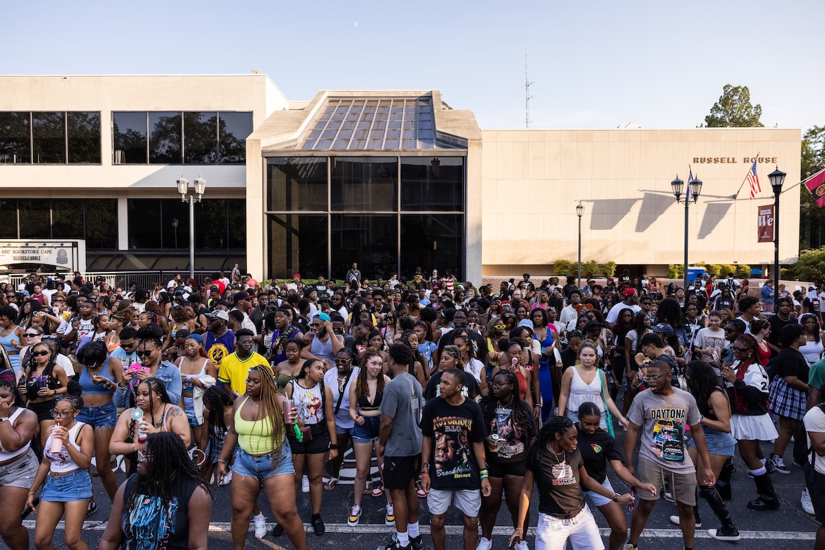 A large crowd of students dancing on Greene Street 