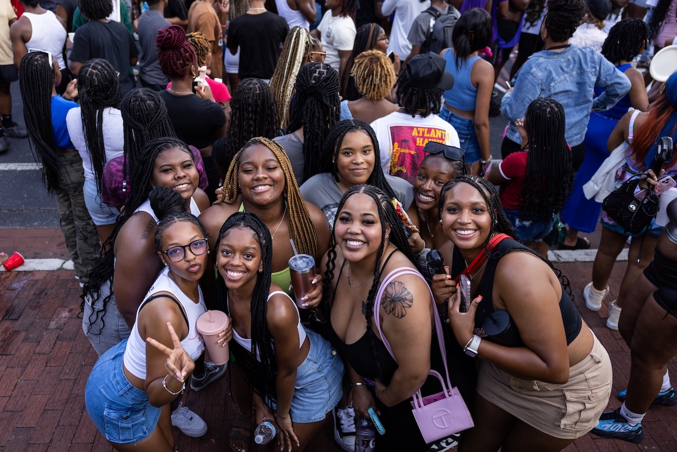 A group of women smiling on Greene Street